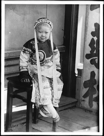 Portrait of a little Chinese girl dressed in traditional clothing, 1920