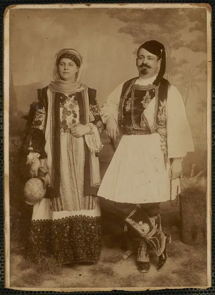 Studio portait of man and woman in traditional Grecian costume, by D. Martimiana, 1890