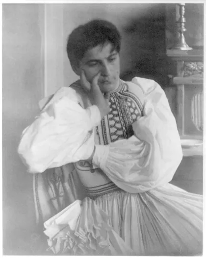 George Demetrios in Greek folk costume, seated, with hand to face, 1913