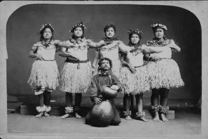 Hula dancers and chanter, photograph by A. A. Montano, 1876