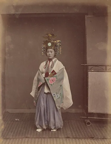 Woman in headdress, 1870